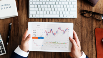 BTCC futures trading strategies chart analysis on tablet showing crypto price movements and trading indicators