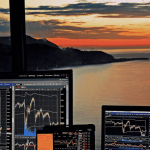 Trader with multiple screens open looking out onto a sunset